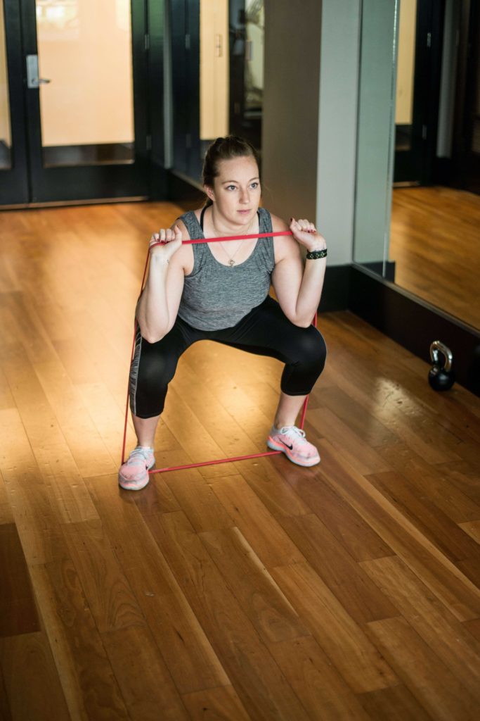 woman working out with resistance band