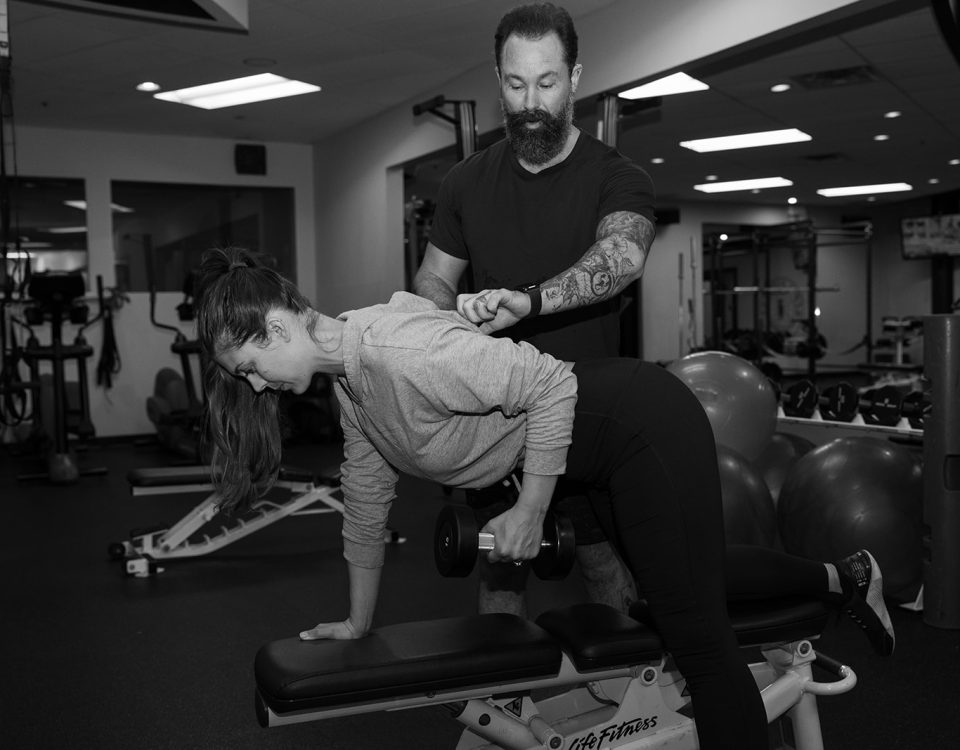 David Turnbull cueing a dumbbell row at TurnFit Vancouver