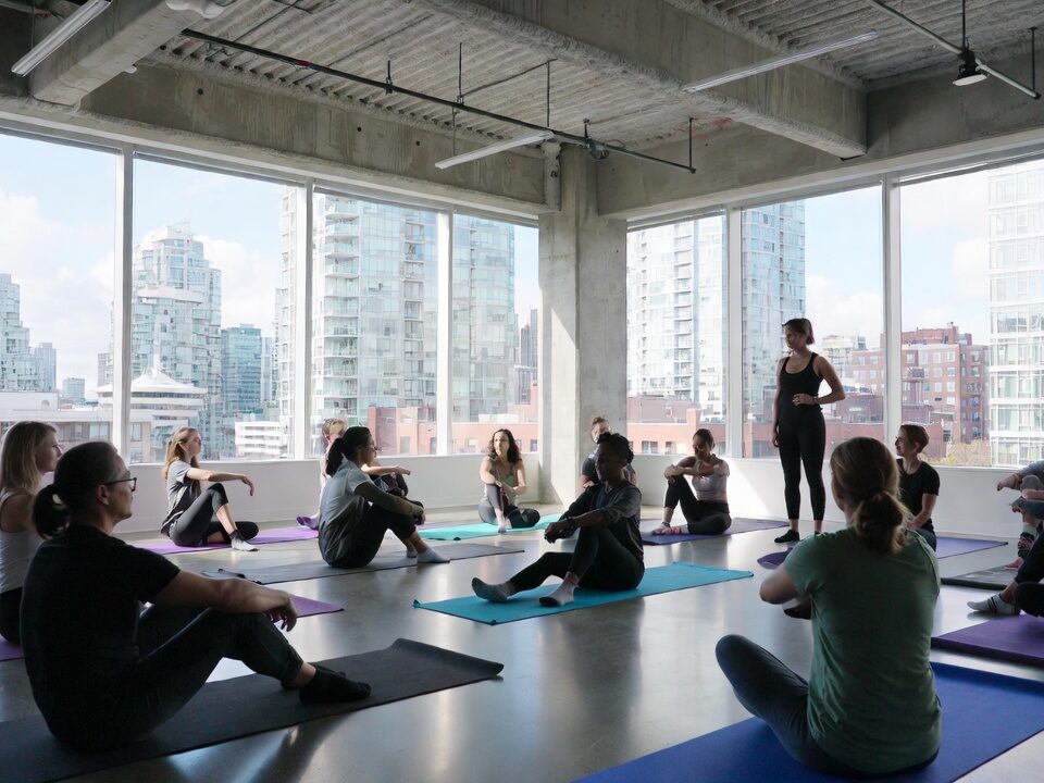 Vancouver corporate wellness personal training session in a Downtown office with city skyline