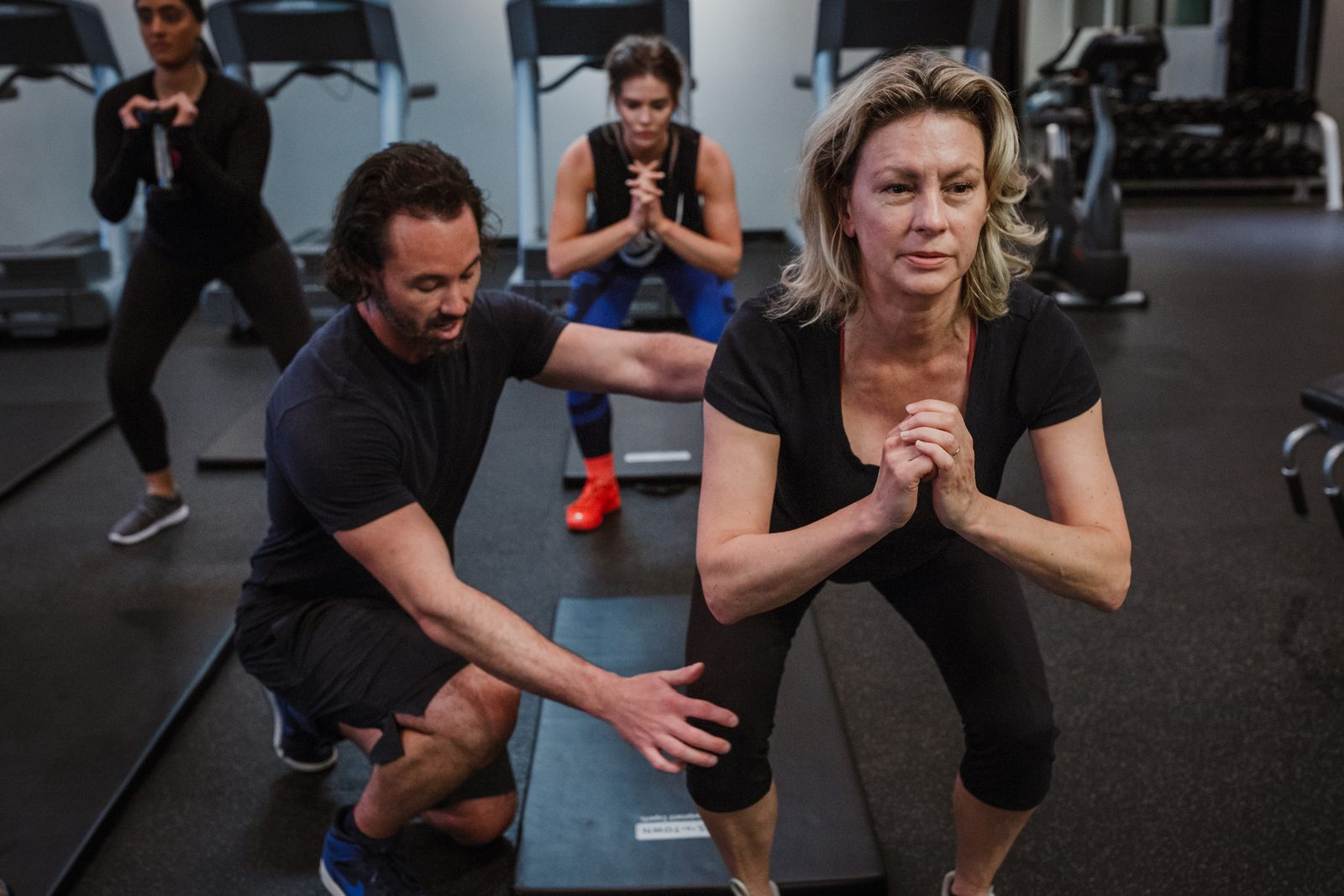 A person lifting weights in a gym